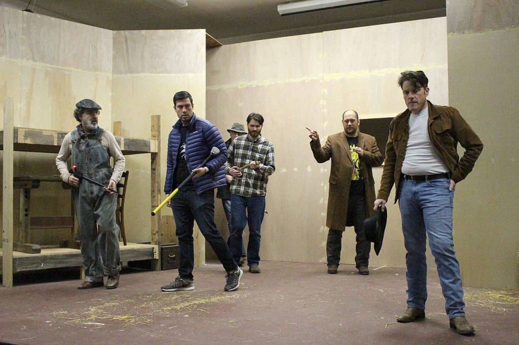 Madison Miller / staff photos                                The cast of VCSs production of Of Mice and Men rehearse for opening night. From left, René Schuchter (Whit), Chris Clark (Curly), Ryan Hartwell Fuller (Carlson), Gavin McLean (Slim) and Tom Stewart (George).