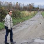 Local Roots owner Siri Erickson-Brown walks along her driveway on Oct. 25. On Oct. 22, the Snoqualmie River flooded her property. She can be seen here pointing at some pumpkins that her staff picked out of the river, presumably from another farm farther upstream. Aaron Kunkler/staff photo