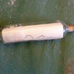 Paige Mino, a seasonal research assistant for the Hawaiian Monk Seal Research Program on Oahu, found a message in a bottle off of Bird Island. The message was from a North Bend Elementary kindergarten class from 1998. Photo courtesy of Paige Mino