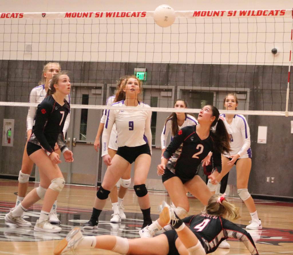 Mount Si volleyball players Megan Underbrink (7), Dana Dolan (2), Jade Petrzelka (4) and Issaquahs Rachel Ratcliffe (9) watch the ball during a regular-season match. Mount Si defeated Issaquah in the 4A KingCo tournament semifinals, 25-21, 23-25, 25-19, 18-25, 15-7, on Nov. 2 and will play North Creek for the title at 7 p.m. on Nov. 5 at Skyline High. For Mount Si (14-3) against Issaquah, Dolan had 43 assists, Bailey Showalter had 27 kills and 28 digs, Breana Fitzgerald had 16 kills and 19 digs, Kaili Tachell had 16 digs and Petrzelka had 11 digs. Mount Si will then host the first round of the 4A Wes-King district tournament on Nov. 9. Benjamin Olson/ staff photo