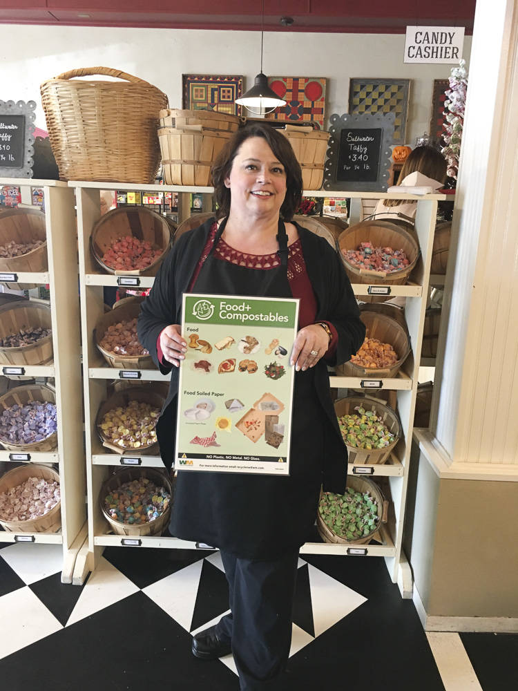 Snoqualmie Falls Candy Shoppe owner Marsha Harris poses after enrolling her business in composting services through a program offered by the City of Snoqualmie and Waste Management. Businesses can join the limited time assistance program through the end of the year. Courtesy photo