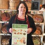Snoqualmie Falls Candy Shoppe owner Marsha Harris poses after enrolling her business in composting services through a program offered by the City of Snoqualmie and Waste Management. Businesses can join the limited time assistance program through the end of the year. Courtesy photo