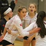 Mount Sis Bailey Showalter, second from left, gathers with some teammates during the 4A KingCo tournament championship match. Andy Nystrom/ staff photo