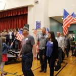 Desi Cuddihys fourth-grade students welcome veterans, including Navy veterans Mark and Angie Kennedy (center) as they enter the Snoqualmie Elementary Veterans Day assembly on Nov. 8. Madison Miller / staff photo