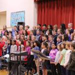 Desi Cuddihys fourth grade class sing patriotic songs at Snoqualmie Elementarys Veterans Day assembly. Madison Miller / staff photo