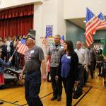 Desi Cuddihys fourth-grade students welcome veterans, including Navy veterans Mark and Angie Kennedy (center) as they enter the Snoqualmie Elementary Veterans Day assembly on Nov. 8. Madison Miller / staff photo