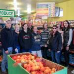 Snoqualmie Valley Food Bank team members, from left, volunteers Don and Carolyn DeVolder, Mount Si High School sophomore Shira Shecter, volunteer Becky Sydnor, Operations Manager Heather Walsh, Teri Wood, Mickey Martindale, and Debbie Rowley with Mount Si freshman daughter Ellie. Natalie DeFord/staff photo
