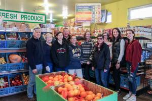 Snoqualmie Valley Food Bank team members, from left, volunteers Don and Carolyn DeVolder, Mount Si High School sophomore Shira Shecter, volunteer Becky Sydnor, Operations Manager Heather Walsh, Teri Wood, Mickey Martindale, and Debbie Rowley with Mount Si freshman daughter Ellie. Natalie DeFord/staff photo