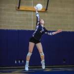 Wildcat Dana Dolan fires off a serve against Issaquah. Photo courtesy of Don Borin