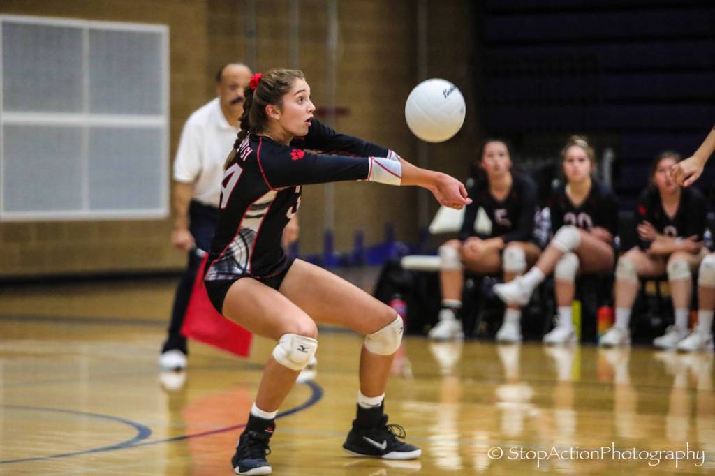 Mount Sis Bailey Showalter digs the ball against Issaquah. Photo courtesy of Don Borin