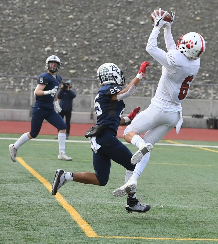 Brayden Holt snags a touchdown pass against Chiawana. Photo courtesy of Calder Productions