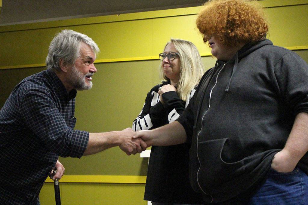 Tim Platt as Scrooge (left) with Natalie Collins and Rick Bennett as charity solicitors in VCSs production of A Christmas Carol. Madison Miller / staff photo