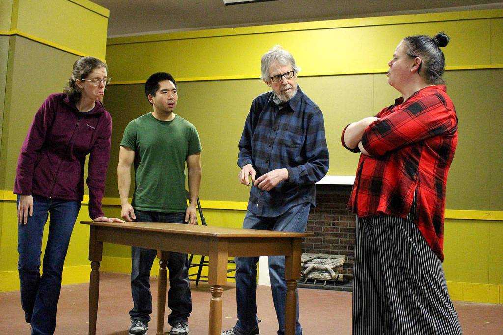 Lucy Adams, Tim Takechi, Craig Ewing and Renee Lystad rehearse for VCSs production of A Christmas Carol on Nov. 19. Madison Miller / staff photo