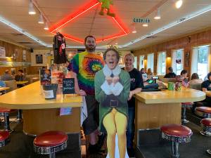 Jacob Pass and Anita Young at Twedes Cafe with Buddy the Elf during a North Bend Downtown Foundation photo campaign promoting downtown businesses. Natalie DeFord/staff photo