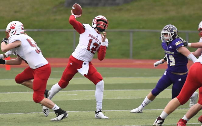 Mount Si quarterback Clay Millen throws a 69-yard pass to wide receiver Aidan Dougherty late in the first half of a 24-22 win on Nov. 23. Photo courtesy of Calder Productions