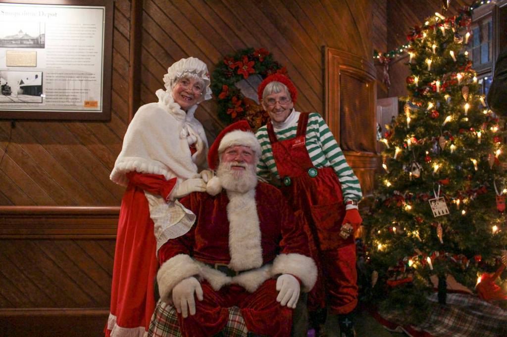 Mrs. Claus, Zoe the oldest Elf, and Santa Claus at the Northwest Railway Museums Snoqualmie Depot during their 50th annual Santa Train event. Natalie DeFord/staff photo