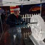 Ice carver Brian Mitchell of Seattle carves a work commemorating the 50th anniversary of the Northwest Railway Museums Santa Train. It took Mitchell about two hours to complete the work, a combination of three separate pieces fuzed together. Corey Morris/staff photo