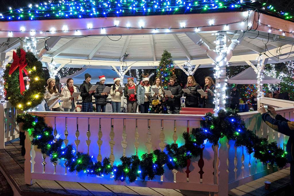 A combination of choirs from Mount Si High School sing holiday songs in the gazebo during the annual Winter Lights celebration on Dec. 7 in Snoqualmie. Corey Morris/staff photo
