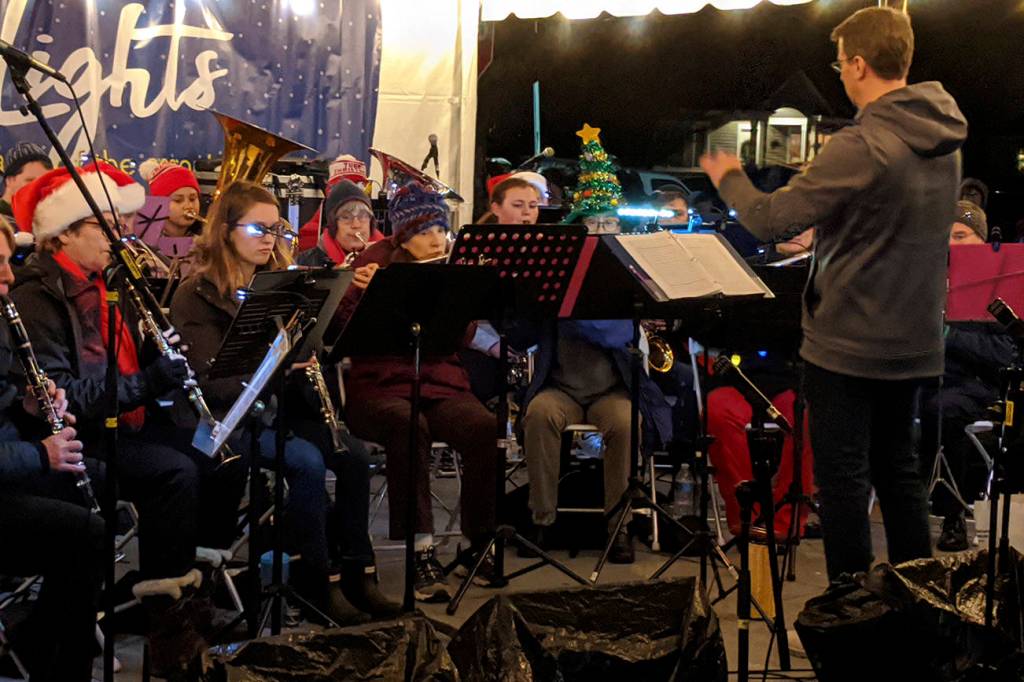 Sno Valley Winds, an adult community band in the Snoqualmie Valley, entertains the crowd moments before the tree lighting ceremony at 2019 Winter Lights in Snoqualmie on Dec. 7. Corey Morris/staff photo