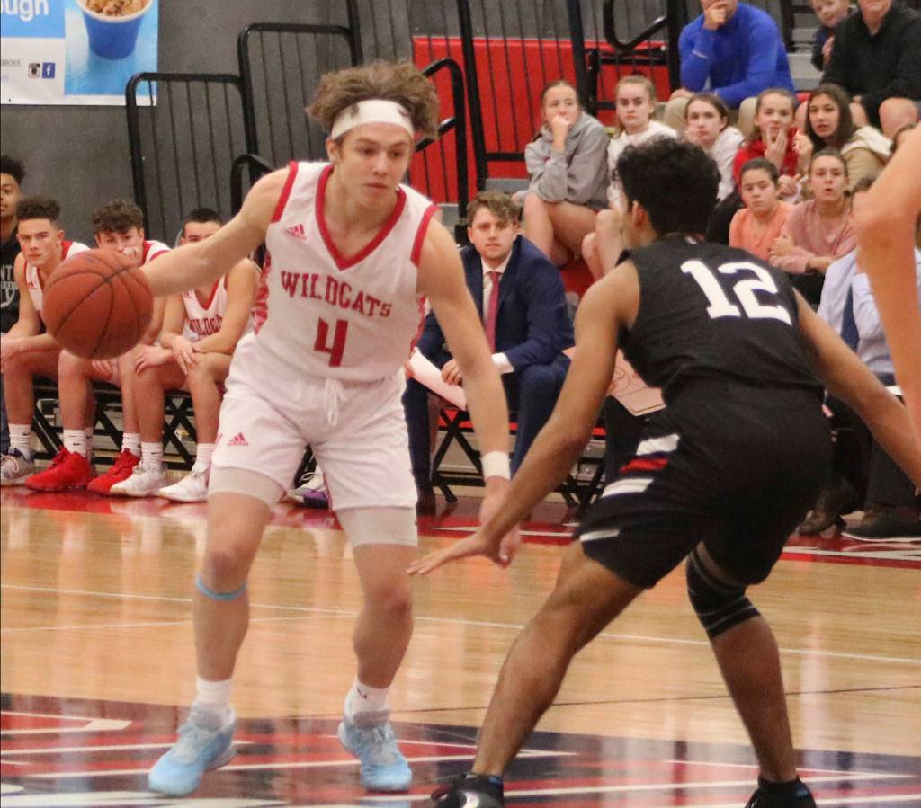 Mount Si sophomore guard Bennett OConnor (left) looks for a path to the basket during the Wildcats 68-51 loss to Union on Dec. 14. Benjamin Olson/staff photo