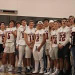 Members of the Mount Si football team watch a highlight montage from their 2019 season during halftime of the boys basketball game on Dec. 14.