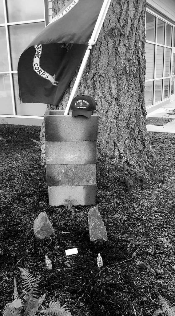 A makeshift memorial sits outside North Bend City Hall during a memorial march held in memory of veterans Andrew Yoder and Travis Corbet. They were killed last spring when a crane collapsed in Seattle. photo courtesy of Jim Curtis