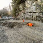 Beyond a clearly marked barricade, King County Road Services workers conduct a brief initial assessment of a landslide that occurred on Dec. 20, severely damaging Middle Fork Road, which will remain closed for an unknown extended period of time. It is extremely dangerous for pedestrians and bike traffic to go around the barricade. Photo courtesy of King County Road Services.