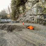 Beyond a clearly marked barricade, King County Road Services workers conduct a brief initial assessment of a landslide that occurred on Dec. 20, severely damaging Middle Fork Road, which will remain closed for an unknown extended period of time. It is extremely dangerous for pedestrians and bike traffic to go around the barricade. Photo courtesy of King County Road Services.