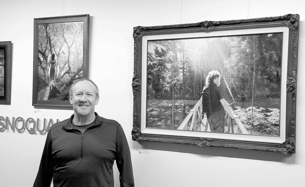 Courtesy photo                                Artist Mike Winterbauer at a showing of his artwork in Snoqualmie City Hall.