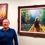 Courtesy photo                                Artist Mike Winterbauer at a showing of his artwork in Snoqualmie City Hall.