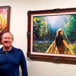 Courtesy photo                                Artist Mike Winterbauer at a showing of his artwork in Snoqualmie City Hall.