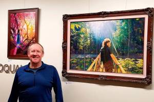 Courtesy photo                                Artist Mike Winterbauer at a showing of his artwork in Snoqualmie City Hall.
