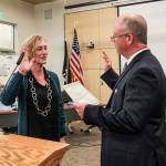 Natalie DeFord/staff photo                                North Bend Mayor Rob McFarland swears in new Councilmember Mary Miller at the Jan. 7 council meeting.