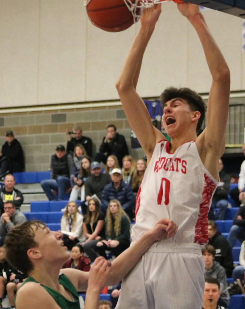 Mount Si senior Hayden Curtiss throws down a dunk during a district playoff game against Woodinville on Feb. 15. Benjamin Olson/staff photo