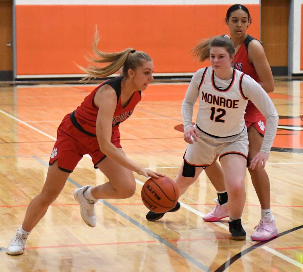 Joelle Buck (left) scored 12 points during Mount Sis victory over Monroe on Feb. 14 at Monroe High School. Photo courtesy of Calder Productions