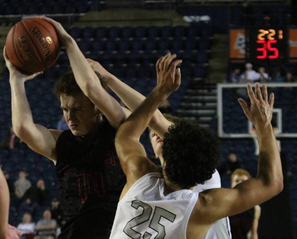 Mount Sis Jack Williams snags a rebound against Glacier Peak in the 4A state semifinals on Friday at the Tacoma Dome. Andy Nystrom/ staff photo