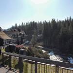 Natalie DeFord/Staff photo. Passersby enjoy a sunny days view of Snoqualmie Falls and the Salish Lodge Spa.