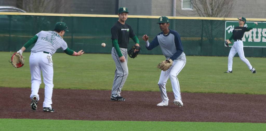 Redmond Highs baseball team gets in a workout on March 11. Andy Nystrom/ staff photo