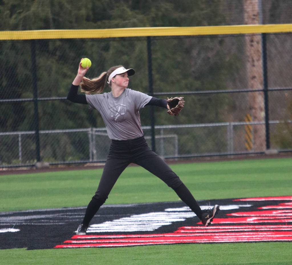 Molly Wilbourne makes a play in center field during a March 10 practice on the teams new turf field. Andy Nystrom/ staff photo