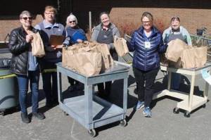 Photo courtesy of Carolyn Malcolm                                 Snoqualmie Valley School District food services staff hands out meals to students on March 19 at Opstad Elementary. From left, Director Pam Chambers with team members Cheryl Tracy, Barbie Travis, Danielle Wood, Michele McDaniel and Debbie Johnson.