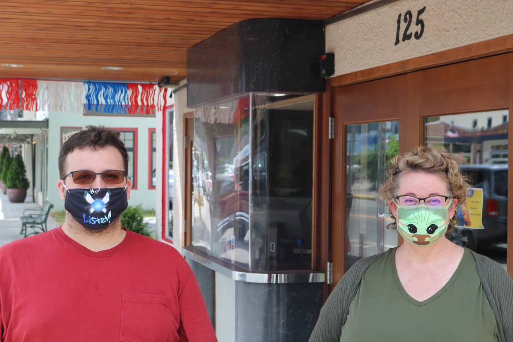 Beth Burrows, owner of the North Bend Theatre, stands outside the facility with manager Skyler Possert. Theyre hoping to reopen the theater ahead of the Aug. 21 release of Mulan. Aaron Kunkler/staff photo