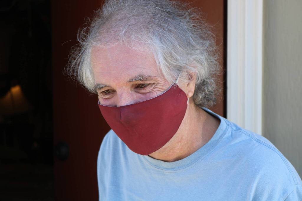Robert Allen, 61, pictured outside his room at the North Bend Motel in August 2020. Aaron Kunkler/staff photo