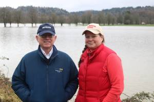 Elbridge Stuart and Rosy Smit stand in front of Carnation Farms flooded fields on Feb. 7, 2020. Its the fifth flood this year along the Snoqualmie River that has broken 56 feet. File photo