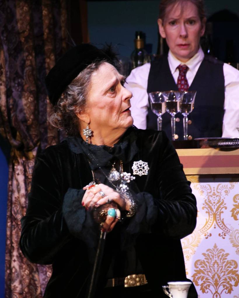Photo by Rosalind Chaffee, courtesy of Valley Center StageA February 2020 photo from Valley Center Stages production of Murder on the Orient Express shows Becky Rappin as Princess Dragomiroff and Melissa Collins-Henderson as The Bartender.
