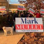 Mark Mullet and supporters wave signs Oct. 28. Courtesy photo