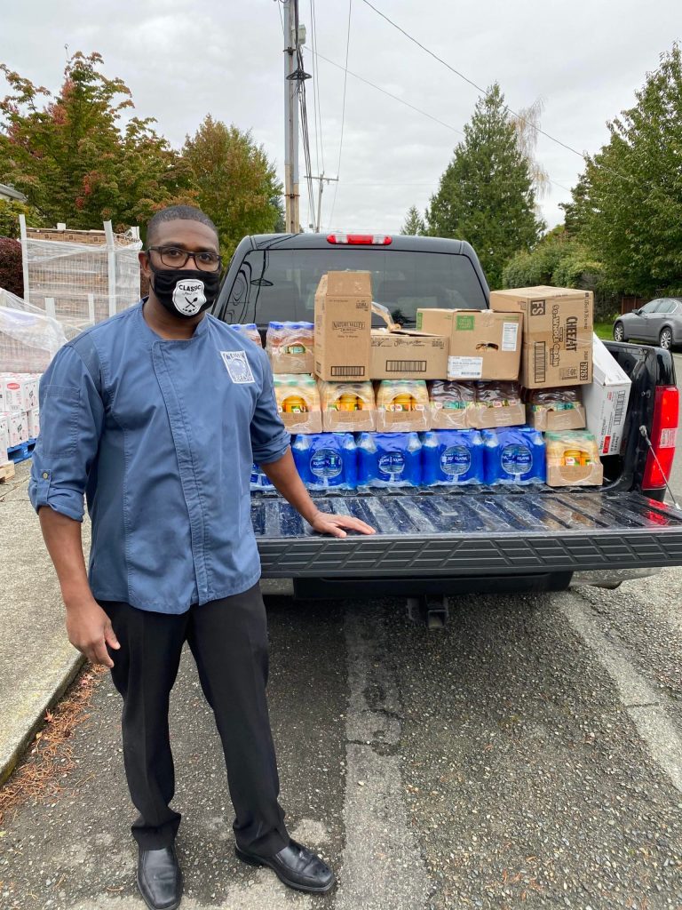 Classic Eats Restaurant owner Tony Hayes distributing food to Highline School District staff. Courtesy photo/Tony Hayes.