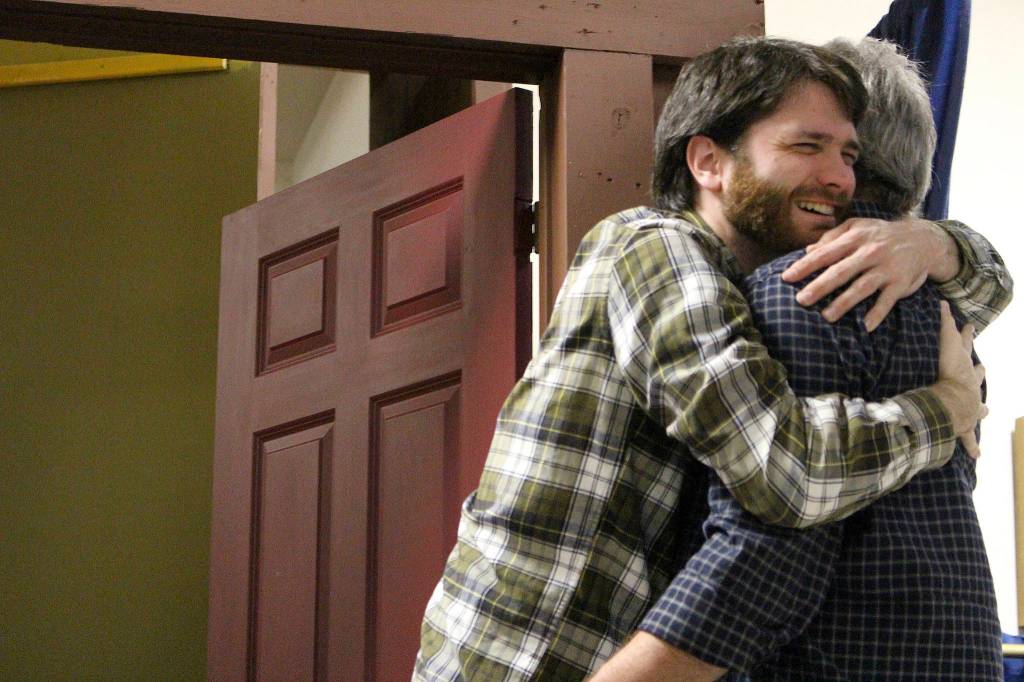 Ryan Hartwell (Fred) hugs Tim Platt (Scrooge) in the final scene of VCSs production of A Christmas Carol in 2019. File photo