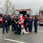 A photo of first resonders, the fire dog and Santa, who collected food donations for the Snoqualmie Valley Food Bank this month. Contributed by the city of Snoqualmie