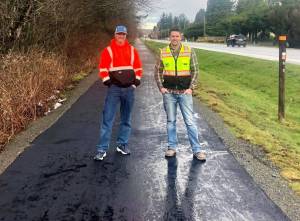 Tom Merry of Rainier Asphalt and Mike Day of Fury Site Works on the new Tanner Trail extension. Contributed by North Bend