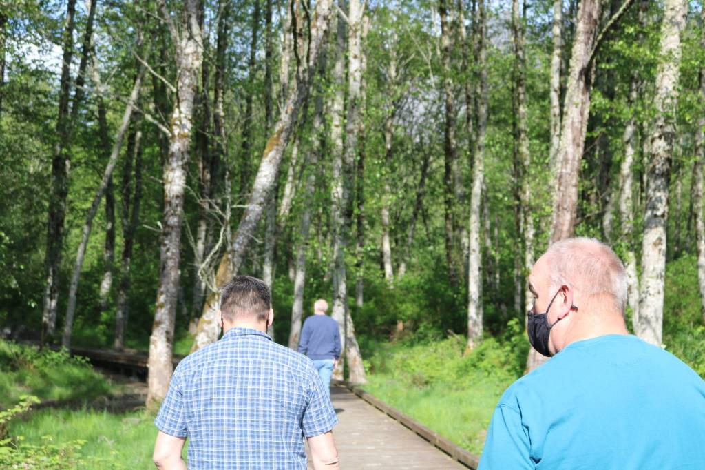 Aaron Kunkler/Staff photo
Snoqualmie Valley Youth Activities Center President Joel Yoker (left) walks to the back 15-acres of their property with board members Byron Moore (center) and Joe Hannan (right). The first phase of the new nonprofit community center is nearing completion.